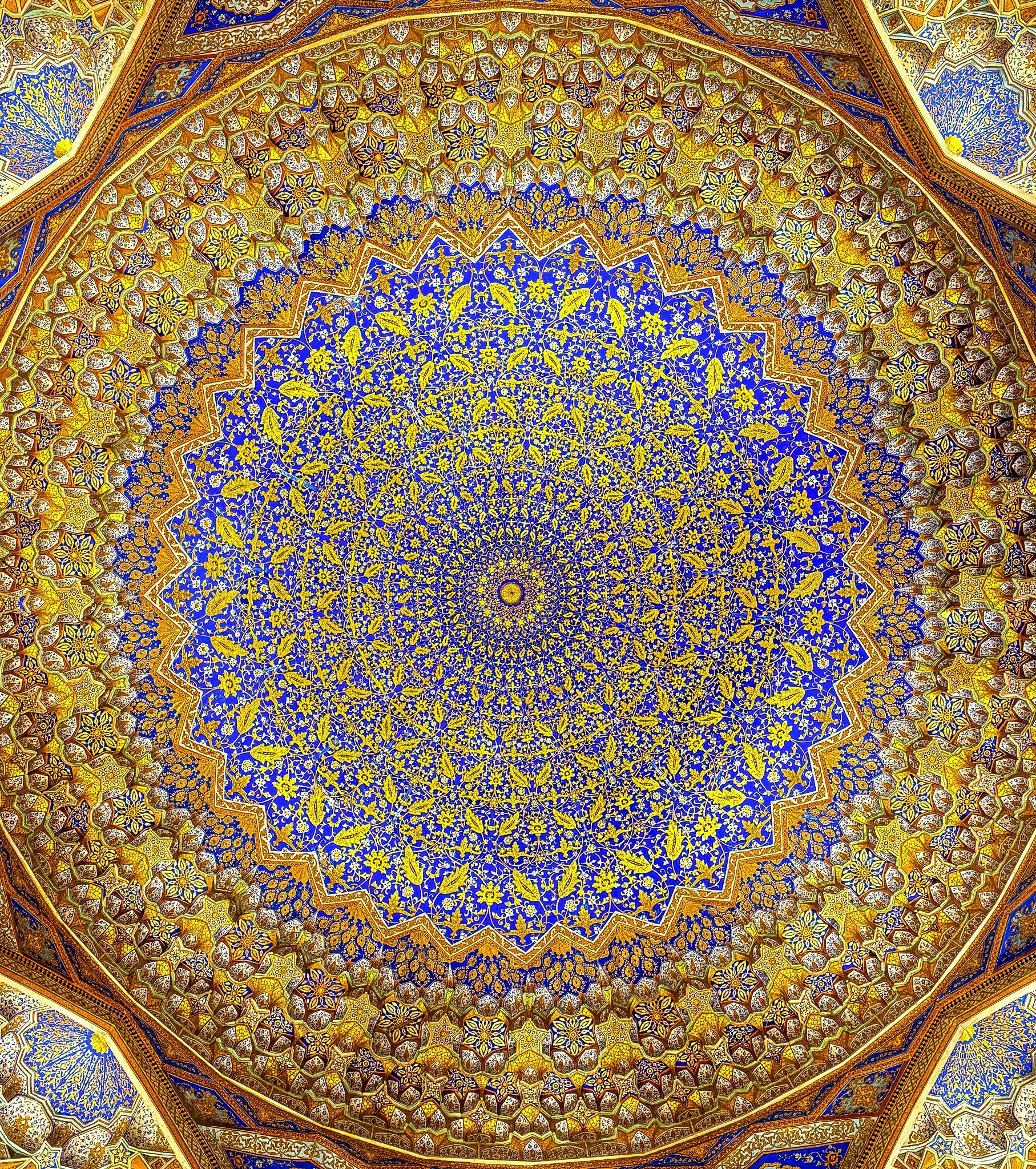Celestial Geometry — intricate geometric patterns of a domed ceiling reaching toward the sky